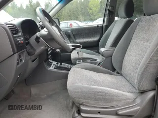 2002 Isuzu Rodeo S with VIN 4S2CK58W124301647, listed as a Copart auction lot 56973895 with 129,009 mi miles and Salvage title. Bid and sale history available at DreamBid. Image 7.