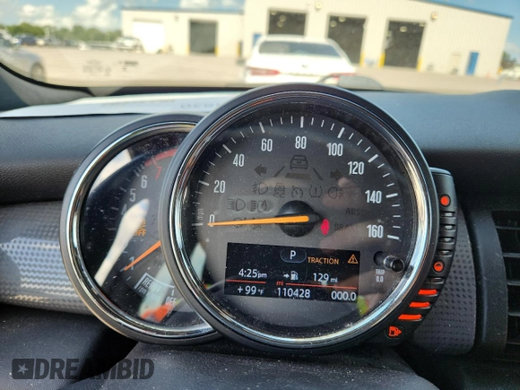 2015 MINI Hardtop with VIN WMWXM5C59FT939742, listed as a Copart auction lot 63778555 with 110,428 mi miles and Salvage title. Bid and sale history available at DreamBid. Image 9.