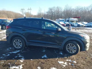 2016 Hyundai Tucson SE with VIN KM8J3CA42GU076476, listed as a IAAI auction lot 41272580 with 112,010 mi miles. Bid and sale history available at carsss.com. Image 13.