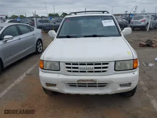 1998 Isuzu Rodeo S with VIN 4S2CM58W0W4331738, listed as a IAAI auction lot 42074562 with 237,684 mi miles. Bid and sale history available at carsss.com. Image 6.