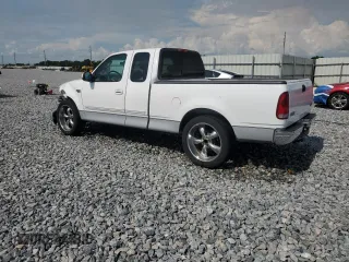 2002 Ford F-150 XL with VIN 1FTRX17272NB01218, listed as a Copart auction lot 61336795 with 201,972 mi miles and Salvage title. Bid and sale history available at DreamBid. Image 2.