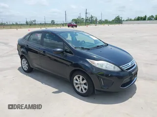 2012 Ford Fiesta SE z VIN 3FADP4BJ4CM158570, wystawiony jako IAAI lot #42280602 z przebiegiem 148 431 mil mil oraz . Historia ofert i sprzedaży dostępna na DreamBid. Obrazek 1.