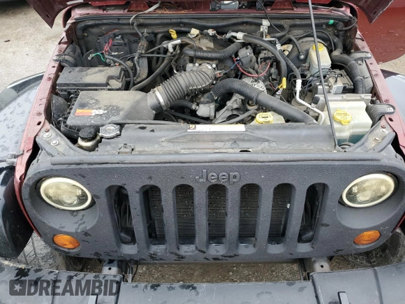 2007 Jeep Wrangler Unlimited Sahara z VIN 1J4GB59157L199454, wystawiony jako Copart lot #82314724 z przebiegiem Nie podano mil oraz Czysty tytuł • Clean title. Historia ofert i sprzedaży dostępna na DreamBid. Obrazek 11.