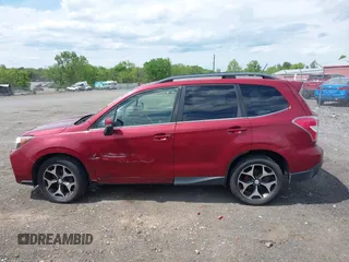 2014 Subaru Forester XT Touring with VIN JF2SJGMC1EH500150, listed as a IAAI auction lot 42201409 with 106,728 mi miles and . Bid and sale history available at DreamBid. Image 14.