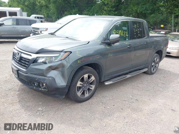 2018 Honda Ridgeline RTL-T with VIN 5FPYK3F61JB013733, listed as a IAAI auction lot 42548122 with 92,407 mi miles and . Bid and sale history available at DreamBid. Image 2.