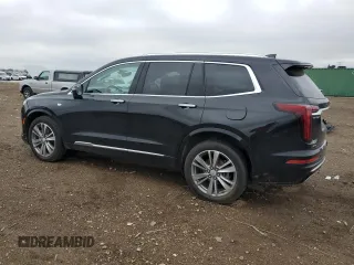 2022 Cadillac XT6 Premium Luxury z VIN 1GYKPFRS9NZ103281, wystawiony jako Copart lot #55118485 z przebiegiem 52 413 mil mil oraz Szkoda całkowita • Salvage title. Historia ofert i sprzedaży dostępna na DreamBid. Obrazek 2.