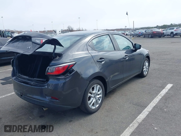 2018 Toyota Yaris with VIN 3MYDLBYV2JY321213, listed as a IAAI auction lot 41890815 with 94,089 mi miles and . Bid and sale history available at DreamBid. Image 4.
