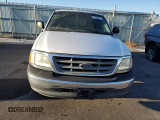 2000 Ford F-150 with VIN 1FTRX17W8YKB11043, listed as a Copart auction lot 77390664 with 181,439 mi miles and Salvage Title. Bid and sale history available at DreamBid. Image 5.