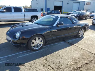 2004 Ford Thunderbird Deluxe with VIN 1FAHP60A94Y105675, listed as a Copart auction lot 87677015 with 91,154 mi miles and Salvage Title. Bid and sale history available at carsss.com. Image 1.