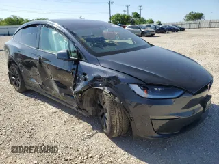 2023 Tesla Model X with VIN 7SAXCDE5XPF422163, listed as a Copart auction lot 52573185 with Not Provided miles and Salvage Title. Bid and sale history available at DreamBid. Image 4.