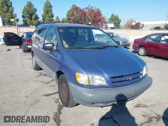 1999 Toyota Sienna LE with VIN 4T3ZF13C2XU126738, listed as a IAAI auction lot 41012127 with 218,080 mi miles. Bid and sale history available at carsss.com. Image 1.