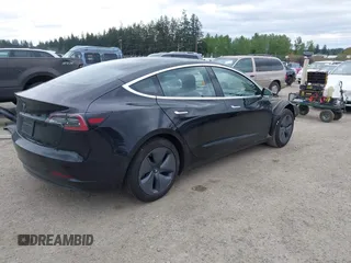 2019 Tesla Model 3 Mid Range with VIN 5YJ3E1EA6KF415656, listed as a IAAI auction lot 42140763 with 71,408 mi miles and . Bid and sale history available at carsss.com. Image 4.