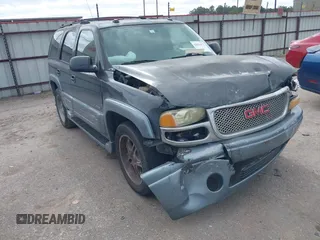 2004 GMC Yukon SLT z VIN 1GKEC13Z44J310511, wystawiony jako IAAI lot #42011475 z przebiegiem 218 746 mil mil oraz . Historia ofert i sprzedaży dostępna na DreamBid. Obrazek 1.