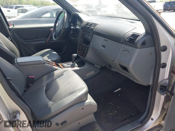 1998 Mercedes-Benz M-Class with VIN 4JGAB54E3WA031579, listed as a IAAI auction lot 42004335 with 156,898 mi miles. Bid and sale history available at carsss.com. Image 5.