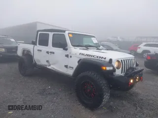 2022 Jeep Gladiator Rubicon z VIN 1C6JJTBG3NL111054, wystawiony jako IAAI lot #40793144 z przebiegiem 40 115 mil mil oraz . Historia ofert i sprzedaży dostępna na DreamBid. Obrazek 1.
