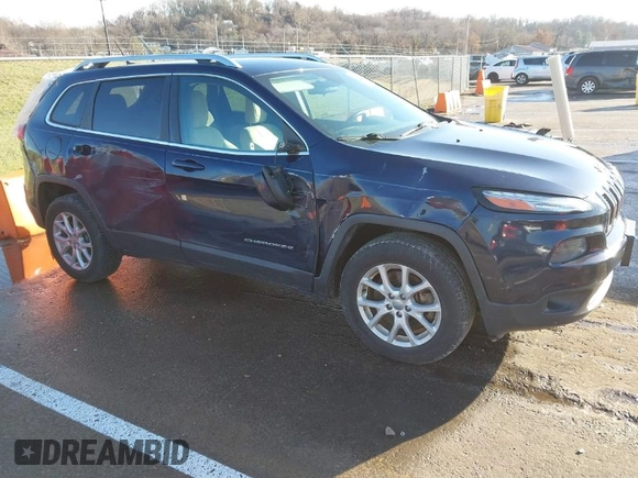 2015 Jeep Cherokee Latitude with VIN 1C4PJMCS0FW583658, listed as a IAAI auction lot 41106819 with 101,849 mi miles. Bid and sale history available at carsss.com. Image 1.