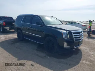 2015 Cadillac Escalade Luxury z VIN 1GYS4BKJ6FR291441, wystawiony jako IAAI lot #41881022 z przebiegiem 128 659 mil mil oraz . Historia ofert i sprzedaży dostępna na DreamBid. Obrazek 1.