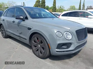 2020 Bentley Bentayga V8 z VIN SJAAM2ZVXLC029237, wystawiony jako IAAI lot #41977974 z przebiegiem 47 248 mil mil oraz . Historia ofert i sprzedaży dostępna na DreamBid. Obrazek 1.