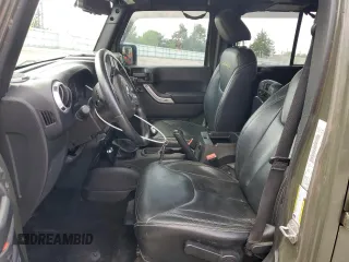 2015 Jeep Wrangler Unlimited Wrangler X with VIN 1C4BJWEG4FL754492, listed as a Copart auction lot 55305825 with 108,078 mi miles and Salvage title. Bid and sale history available at DreamBid. Image 7.