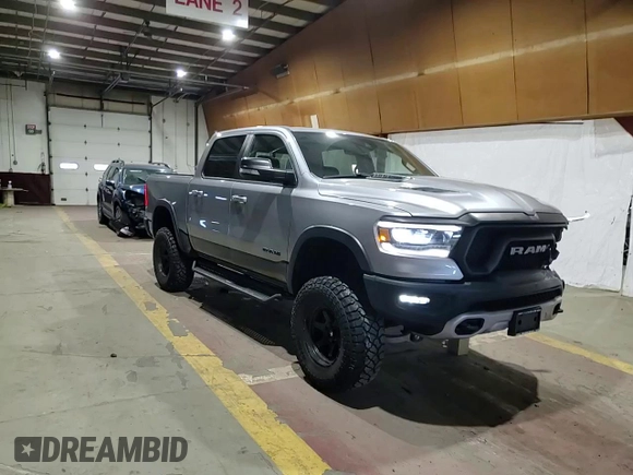 2022 Ram 1500 Rebel z VIN 1C6SRFLT1NN258780, wystawiony jako Copart lot #53040405 z przebiegiem 27 307 mil mil oraz Szkoda całkowita • Salvage title. Historia ofert i sprzedaży dostępna na DreamBid. Obrazek 13.