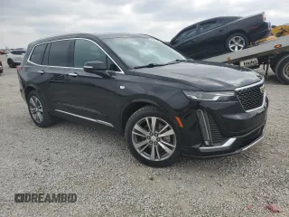2020 Cadillac XT6 FWD Premium Luxury with VIN 1GYKPCRS2LZ138174, listed as a Copart auction lot 52495655 with 30,822 mi miles and Salvage Title. Bid and sale history available at carsss.com. Image 4.