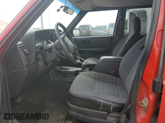 1999 Jeep Cherokee Sport with VIN 1J4FF68S4XL580048, listed as a Copart auction lot 62546365 with 154,059 mi miles and Clean title. Bid and sale history available at DreamBid. Image 7.