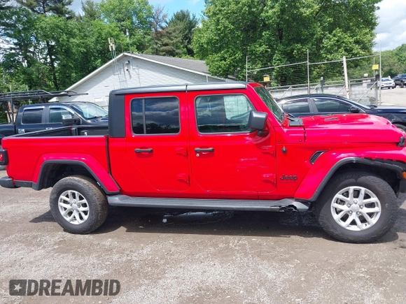 2023 Jeep Gladiator Sport S with VIN 1C6HJTAG8PL572270, listed as a IAAI auction lot 42336294 with 13,865 mi miles and . Bid and sale history available at DreamBid. Image 13.