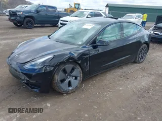 2021 Tesla Model 3 Long Range with VIN 5YJ3E1EB7MF052988, listed as a IAAI auction lot 42052662 with 29,877 mi miles and . Bid and sale history available at carsss.com. Image 2.