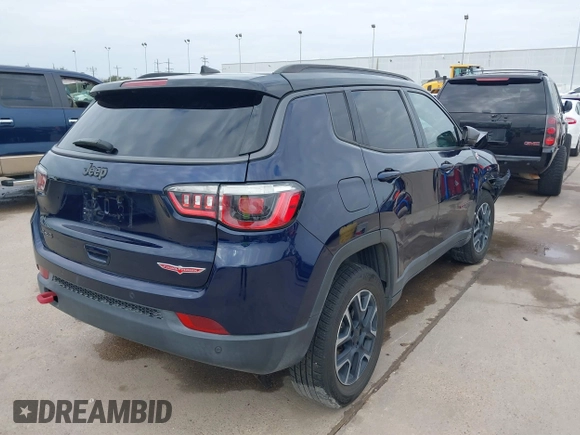 2019 Jeep Compass Trailhawk with VIN 3C4NJDDB8KT619330, listed as a IAAI auction lot 41237920 with 85,144 mi miles and . Bid and sale history available at DreamBid. Image 4.