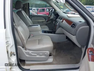 2014 Chevrolet Suburban LT with VIN 1GNSCJE07ER211222, listed as a IAAI auction lot 42428084 with 214,712 mi miles and . Bid and sale history available at DreamBid. Image 5.