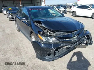 2019 Toyota Camry LE z VIN 4T1B11HK8KU197444, wystawiony jako IAAI lot #41710904 z przebiegiem 137 766 mil mil oraz . Historia ofert i sprzedaży dostępna na DreamBid. Obrazek 1.