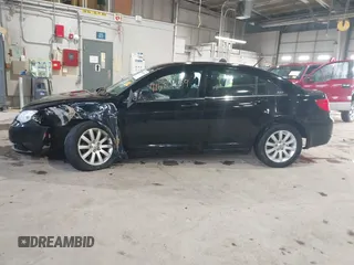 2013 Chrysler 200 Touring with VIN 1C3CCBBB6DN501373, listed as a IAAI auction lot 41587159 with 193,410 mi miles and . Bid and sale history available at DreamBid. Image 14.