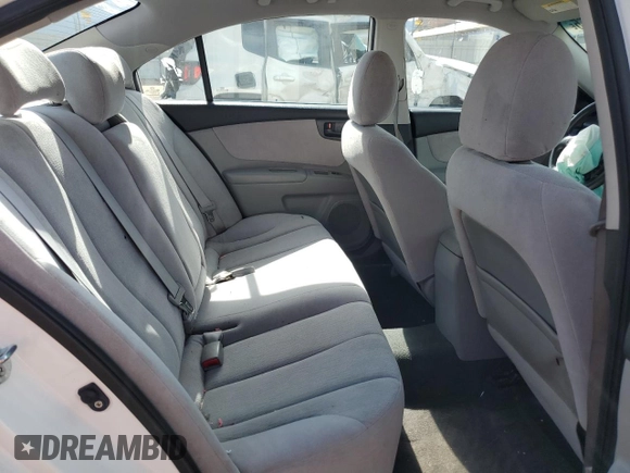 2010 Kia Optima LX z VIN KNAGG4A8XA5382979, wystawiony jako Copart lot #57067065 z przebiegiem 104 611 mil mil oraz Szkoda całkowita • Salvage title. Historia ofert i sprzedaży dostępna na DreamBid. Obrazek 10.