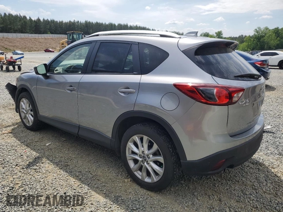 2014 Mazda CX-5 Grand Touring with VIN JM3KE4DY9E0416967, listed as a Copart auction lot 54215285 with 77,296 mi miles and Salvage Title. Bid and sale history available at DreamBid. Image 2.