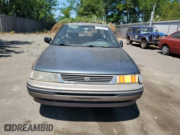 1993 Subaru Legacy L with VIN 4S3BJ6339P6948161, listed as a Copart auction lot 63123584 with 329,619 mi miles and Salvage Title. Bid and sale history available at DreamBid. Image 5.