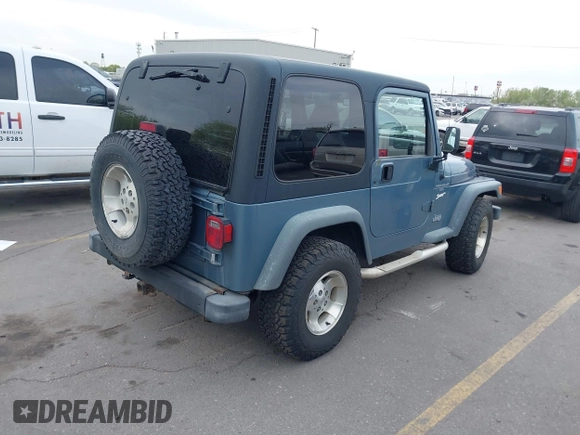 1998 Jeep Wrangler Sport with VIN 1J4FY19S8WP781437, listed as a IAAI auction lot 42096647 with 245,900 mi miles. Bid and sale history available at carsss.com. Image 4.