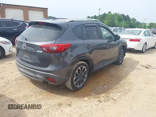 2016 Mazda CX-5 Grand Touring z VIN JM3KE2DY5G0801238, wystawiony jako IAAI lot #42264694 z przebiegiem 136 993 mil mil oraz . Historia ofert i sprzedaży dostępna na DreamBid. Obrazek 4.