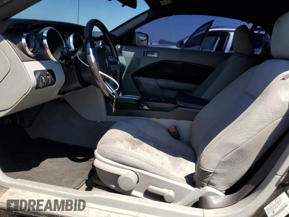 2008 Ford Mustang Deluxe with VIN 1ZVHT84N985193520, listed as a Copart auction lot 56186525 with 140,483 mi miles and Salvage title. Bid and sale history available at DreamBid. Image 7.