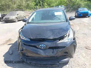 2022 Toyota Prius L Eco with VIN JTDKAMFU1N3182790, listed as a IAAI auction lot 41993264 with 124,777 mi miles and . Bid and sale history available at DreamBid. Image 6.