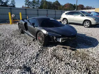 2021 McLaren GT z VIN SBM22GCA8MW001374, wystawiony jako Copart lot #82147064 z przebiegiem 32 562 mil mil oraz Nie do naprawy. Historia ofert i sprzedaży dostępna na DreamBid. Obrazek 14.