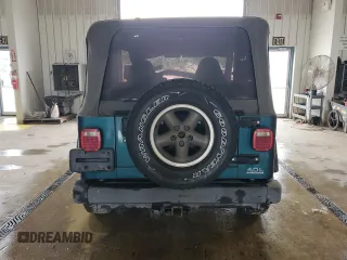1997 Jeep Wrangler Sport with VIN 1J4FY19SXVP537075, listed as a Copart auction lot 61389915 with Not provided miles and Salvage title. Bid and sale history available at DreamBid. Image 6.