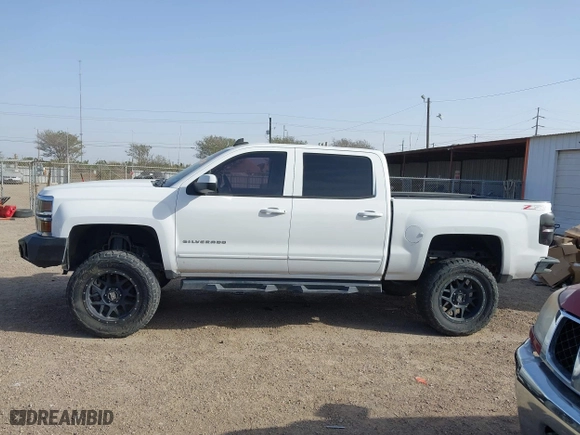 2015 Chevrolet Silverado 1500 LT with VIN 3GCUKREC1FG289851, listed as a IAAI auction lot 41676144 with 131,633 mi miles. Bid and sale history available at carsss.com. Image 14.