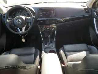 2014 Mazda CX-5 Grand Touring with VIN JM3KE4DY2E0354795, listed as a Copart auction lot 54205775 with 62,939 mi miles and Salvage Title. Bid and sale history available at DreamBid. Image 8.
