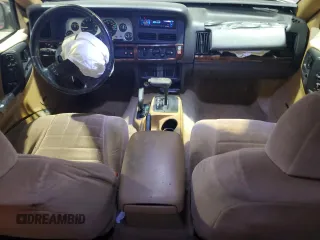 1997 Jeep Grand Cherokee Laredo with VIN 1J4GZ58Y5VC674687, listed as a Copart auction lot 43137095 with 173,228 mi miles and Salvage Title. Bid and sale history available at carsss.com. Image 8.