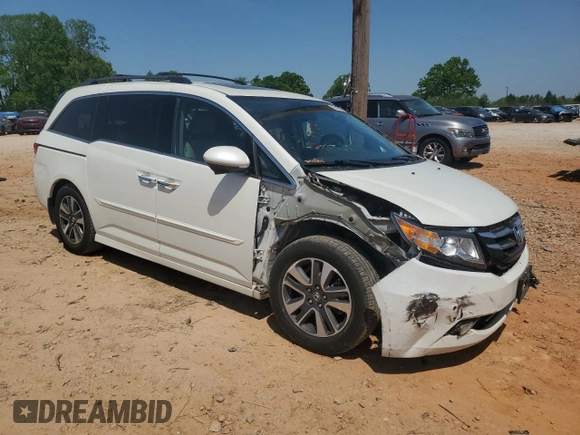 2016 Honda Odyssey Touring Elite with VIN 5FNRL5H94GB109829, listed as a Copart auction lot 52583225 with 70,740 mi miles and Salvage Title. Bid and sale history available at carsss.com. Image 4.