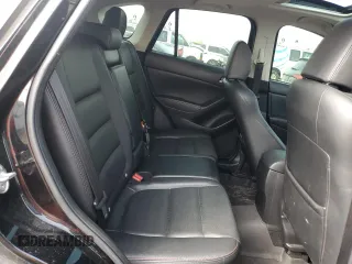 2015 Mazda CX-5 Grand Touring with VIN JM3KE4DY9F0516357, listed as a Copart auction lot 53156215 with 118,621 mi miles and Salvage Title. Bid and sale history available at DreamBid. Image 11.