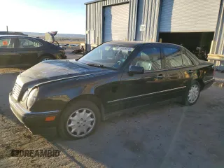 1999 Mercedes-Benz E-Class with VIN WDBJF82H9XX026911, listed as a Copart auction lot 48808835 with 205,953 mi miles and Salvage Title. Bid and sale history available at carsss.com. Image 1.