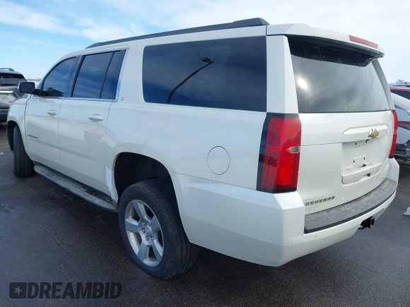 2015 Chevrolet Suburban LT with VIN 1GNSKJKC0FR309866, listed as a IAAI auction lot 41743848 with 220,778 mi miles and . Bid and sale history available at DreamBid. Image 3.