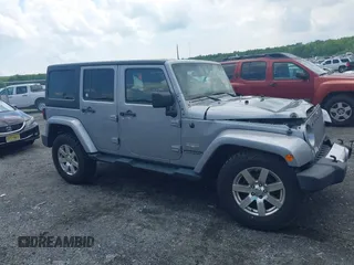 2014 Jeep Wrangler Unlimited Sahara z VIN 1C4BJWEG0EL129229, wystawiony jako IAAI lot #42380976 z przebiegiem 175 735 mil mil oraz . Historia ofert i sprzedaży dostępna na DreamBid. Obrazek 13.