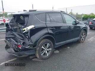 2018 Toyota RAV4 XLE with VIN 2T3WFREVXJW501296, listed as a IAAI auction lot 42358130 with 163,669 mi miles and . Bid and sale history available at DreamBid. Image 4.